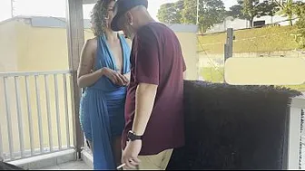 Strangers making out on a balcony during the party.