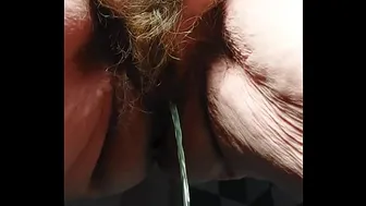 Grandma pees and uses cucumber in hairy pussy